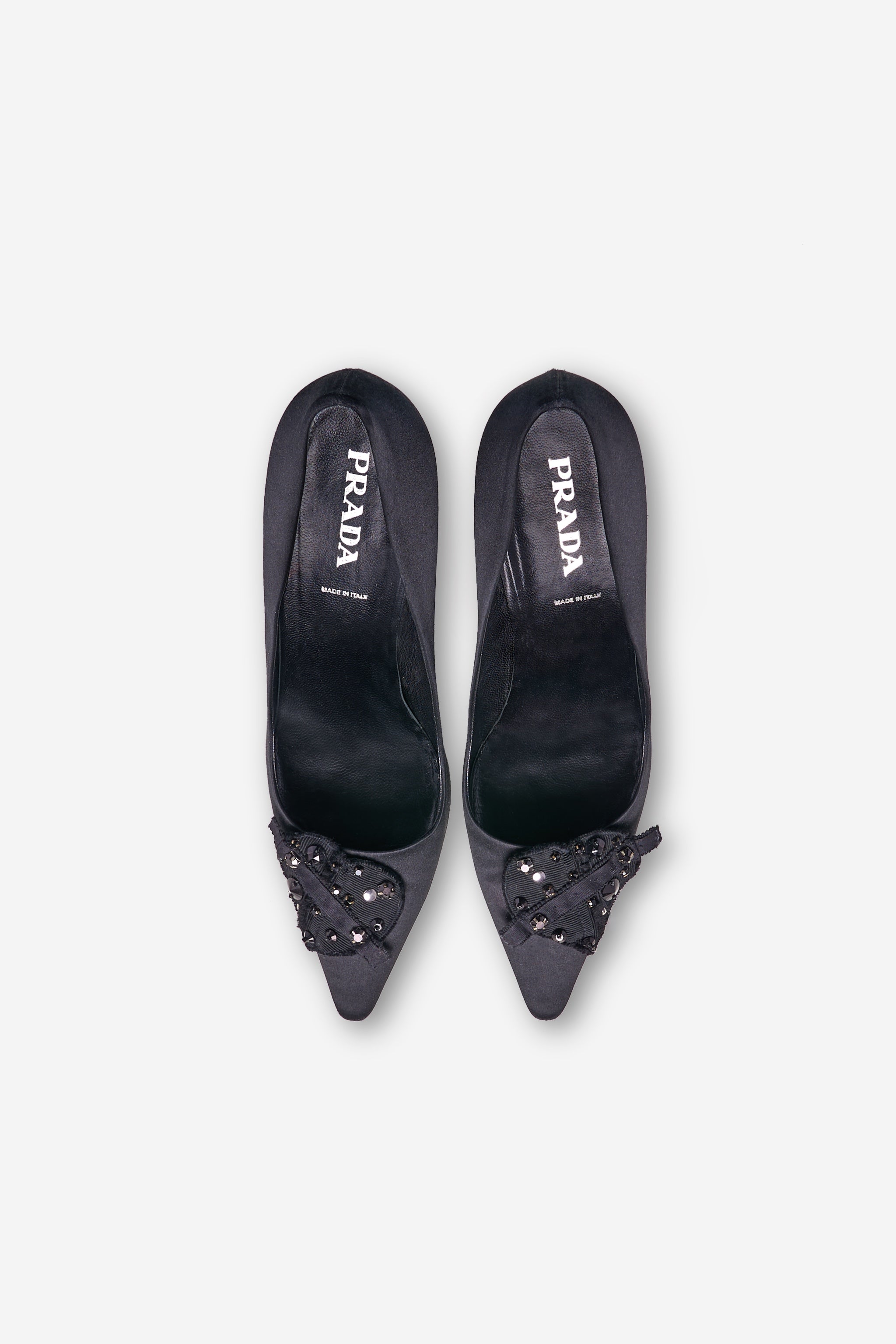 Black satin pumps